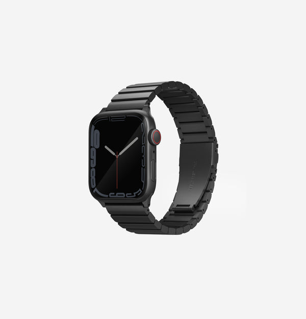 A black stainless steel Apple watch strap.